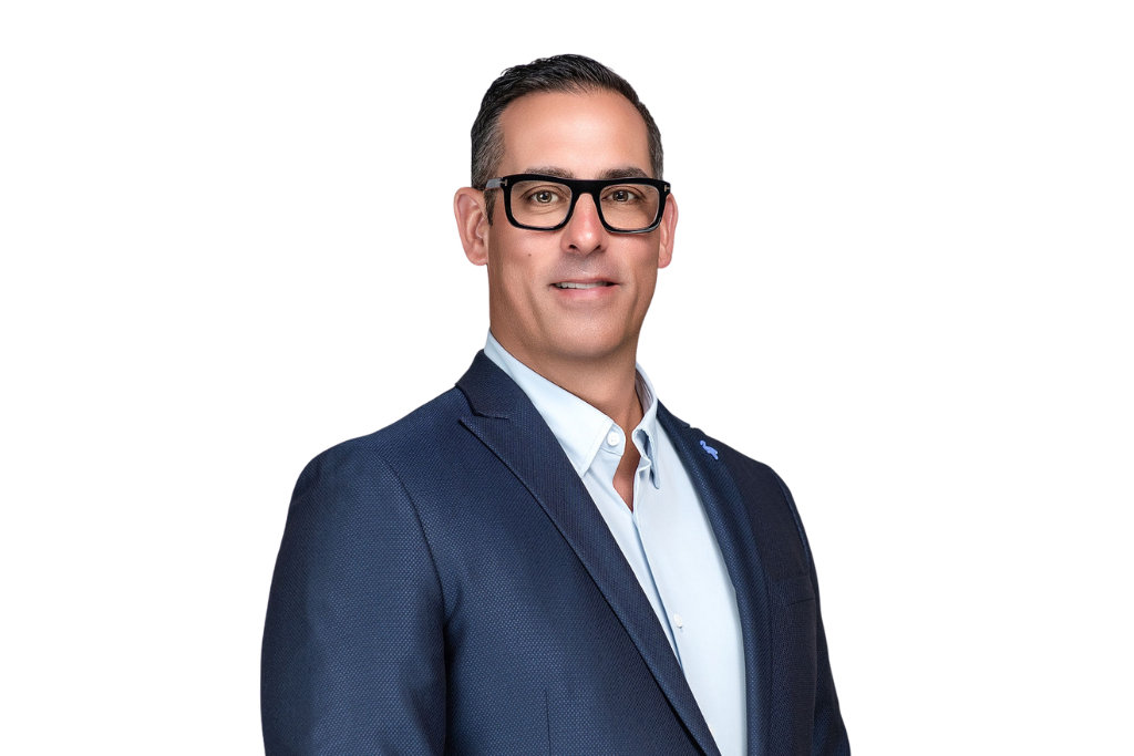 Male with blue suit and black glasses